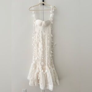 Elegant White Dress with Petal Accents